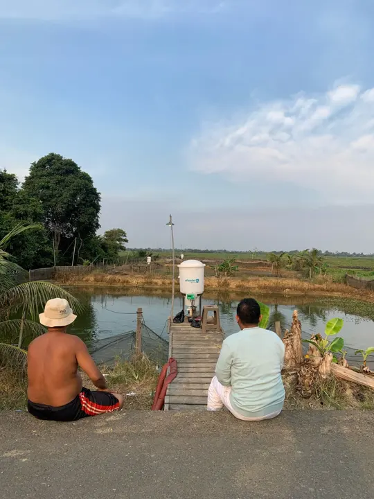 Visiting fish farmers at their ponds in Kalimantan